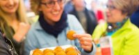 Woman holding a Sicilian Rice Ball